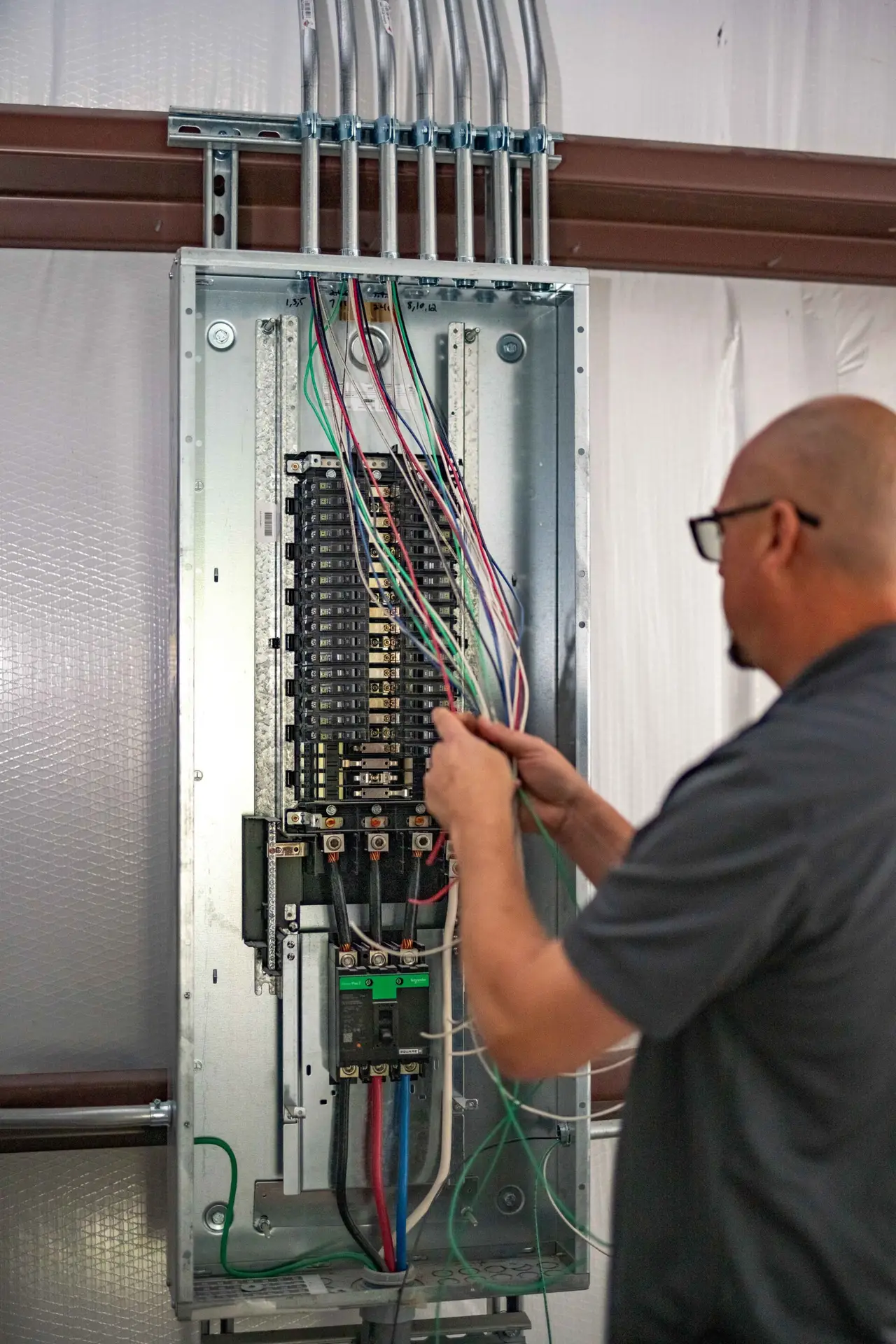 Airstream electrician working on residential wiring